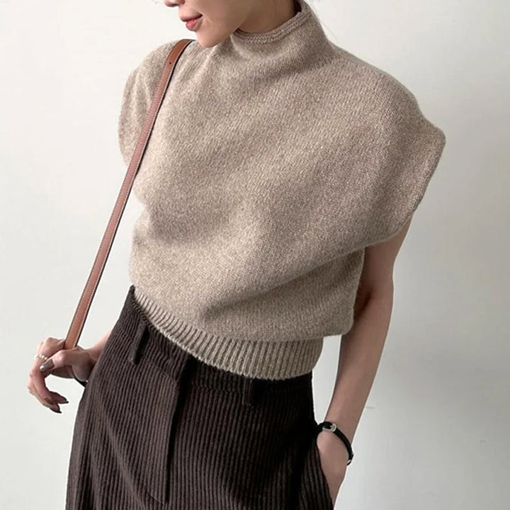 Women's sleeveless turtleneck sweater with ribbed detail