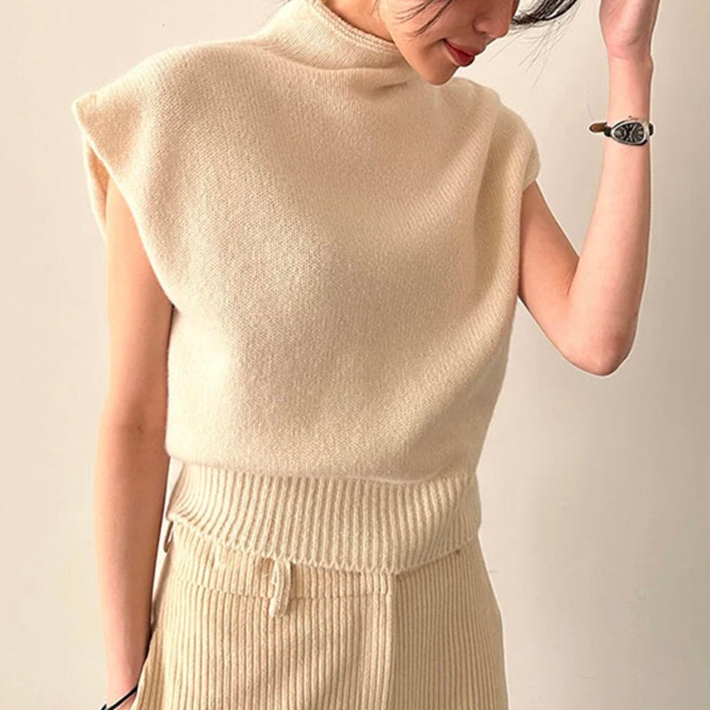Women's sleeveless turtleneck sweater with ribbed detail