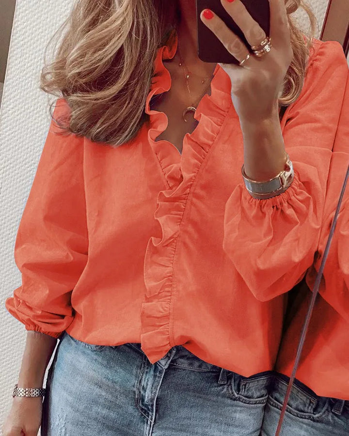 Women's ruffled V-neck blouse for a playful chic look